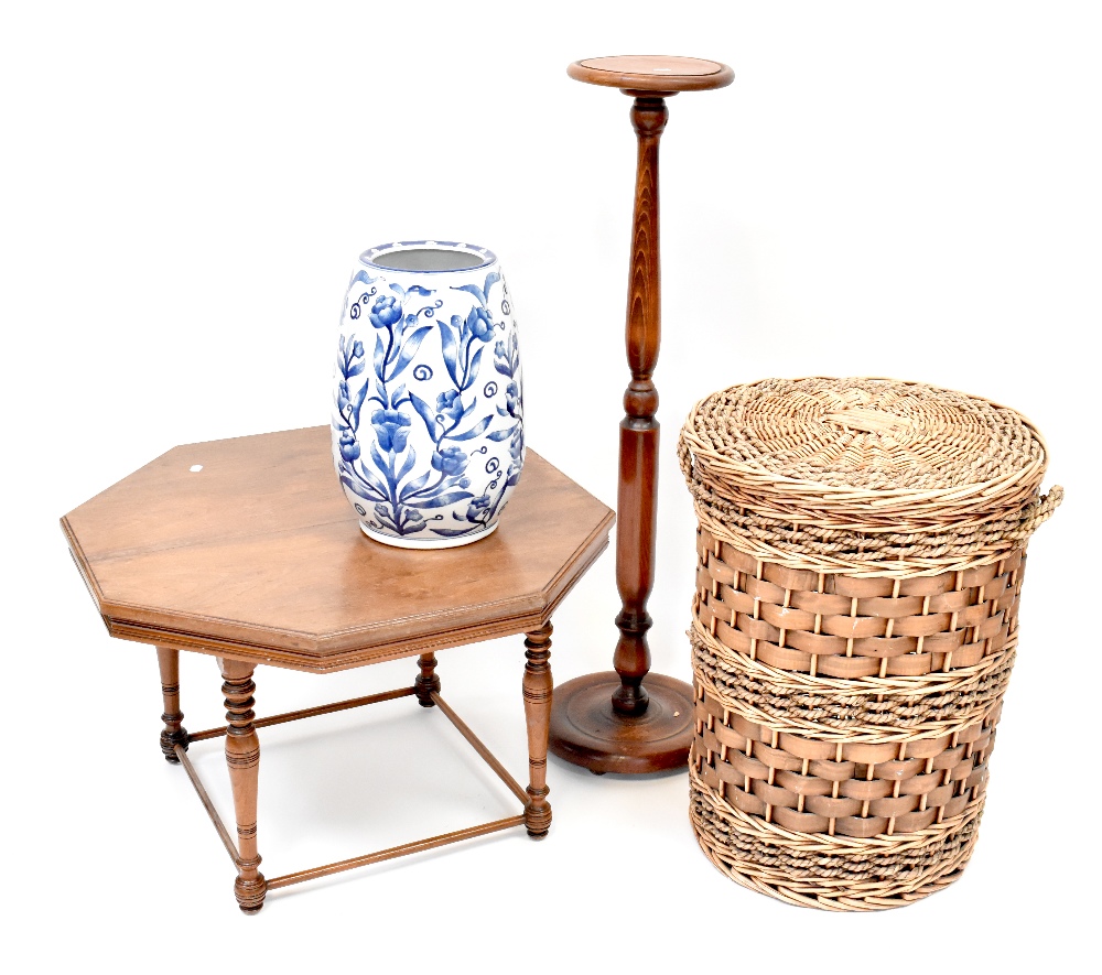 An Edwardian walnut hexagonal top occasional table on turned legs united by stretchers, 49 x 75cm,