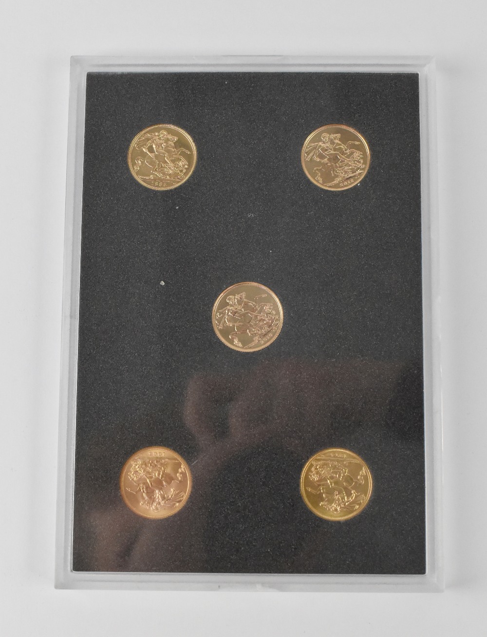 A 'Queen Elizabeth II, five Portraits' five sovereign coin set.