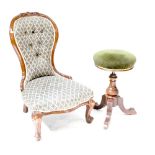 A Victorian spoon back nursing chair to cabriole and ball and claw supports,