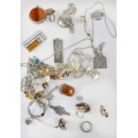 A quantity of modern and modernist-style silver jewellery to include rings, necklaces, brooches,