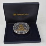 A 2009 'George and Dragon' 5oz, £10 silver coin with gold plated embellishment.