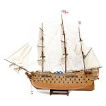 A scratch-built model of a 19th century British warship in full sail, length 103cm.