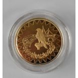 A 24ct gold Kuwait commemorative coin, approx 16.9g.