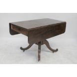 A 19th century mahogany pedestal Pembroke table, central baluster column to quadripartite support,