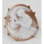 A large carved shell cameo brooch depicting Leda and the Swan,