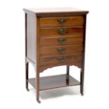 An Edwardian walnut five-drawer music cabinet with square tapering legs united by a undertier,