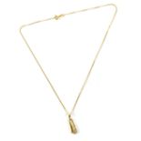 A 14ct gold necklace with pendant drop in the form of a musical instrument omitting musical notes