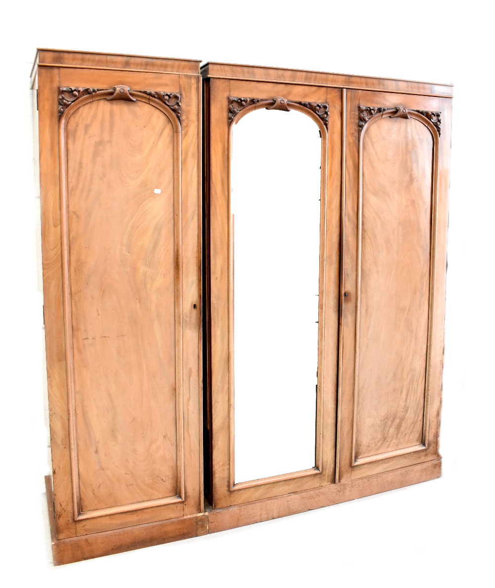 A Victorian mahogany matching linen press and single wardrobe, possibly converted from a triple,