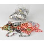 A large bag of mixed costume jewellery.
