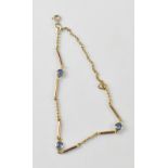 A 9ct gold bracelet with three sapphire cabochons separated with bead and bar links, length 22cm,