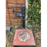 A pair of 19th Century black painted cast iron scales by H.