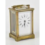 An early 20th century French brass carriage clock, the dial set with Roman numerals, height 11cm.