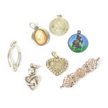 A hallmarked silver brooch and six various sterling silver pendants (7).