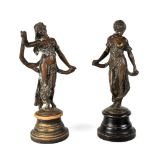 A pair of early 20th century spelter bronzed dancing figures in Classical dress,