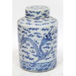 A Chinese blue and white covered jar, hand painted with dragons within clouds, height 40cm.