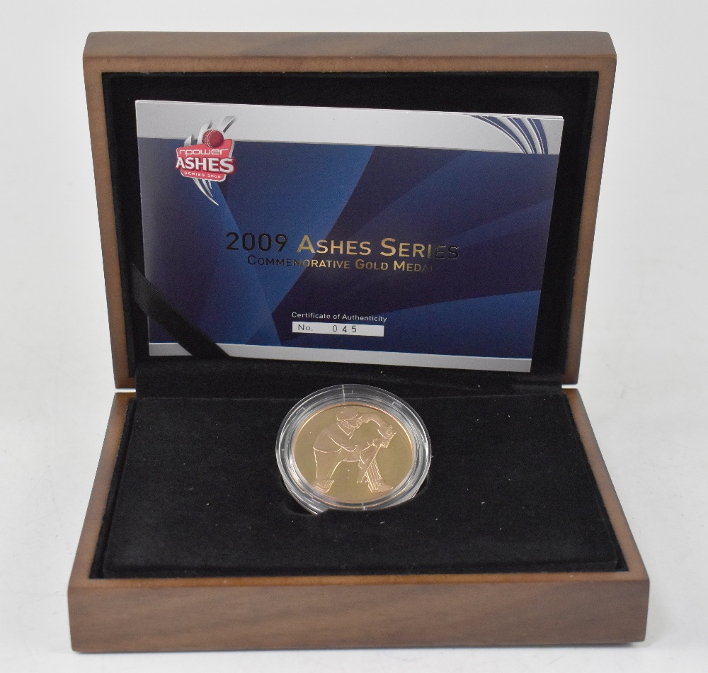 A 2009 'Ashes Commemorative Gold Medal' 22ct gold proof, limited edition no.45/150.