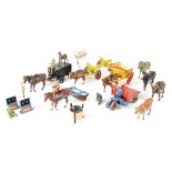 A quantity of early/mid-20th century metal children's farmyard vehicles to include open-back