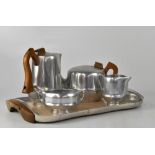 A retro five-piece Picquot ware tea service to include rectangular tray with wooden-handled teapot,