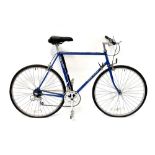A Falcon Super Tourist bicycle in blue with white decals, and a spare set of racing handlebars (2).