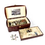A hardwood jewellery box containing a quantity of costume jewellery to include pearl necklaces,