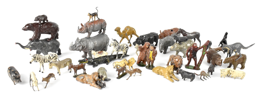 A collection of early/mid-20th century metal zoo animals to include hippopotamus, lions, brown bear,