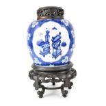 A 19th century Chinese blue and white ginger jar with three cartouches hand painted with writing