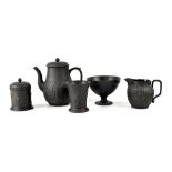 A group of early 20th century Wedgwood and other black basalt ware to include a coffee pot with