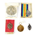 A militaria group comprising a WWI Victory medal, PTE. J. H. Scholes Manch. R.