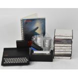 A vintage Sinclair ZX 81 computer with keyboard, power supply, manual, printer,