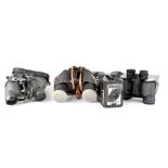 An Optimax pair of 8x30 field binoculars, a further pair of binoculars,