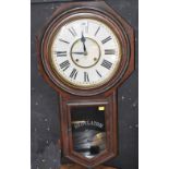 An American drop case regulator wall clock by Ansonia & Co New York, height 81cm.