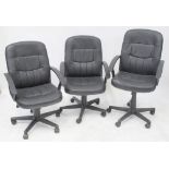Three leather-effect swivel office chairs, each on five-prong base with castors (3).