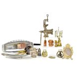 A quantity of mixed metalware to include a tabletop grinder, various brass decorative items,