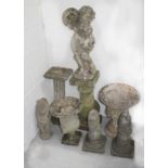 A group of reconstituted stone garden items to include putti with bowl, a Classical column stand,