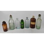 A quantity of vintage and decorative bottles to include pharmaceutical green poison bottles,