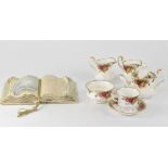 Royal Albert; a 'Country Roses' part tea set to include teapot, cups and saucers, sugar bowl,