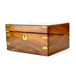 A 19th century rosewood and brass bound writing box with fitted interior and tooled leather slope