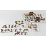A collection of lead Cowboys and Indians to include two wagons with horses,