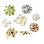 Eight various gem-set brooches (8).