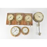 A Sydney Smith & Co brass-cased valve and pressure gauge, fixed on wooden plinth backing,