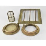 Two brass portholes, diameter 25cm, a ship's fixed window of square form,