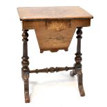 A Victorian inlaid walnut sewing table with original card partitions and silk-covered storage boxes,