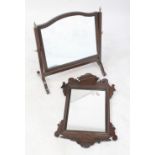 An Edwardian rectangular dressing table swing mirror and a Victorian mahogany fretwork wall hanging