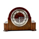 A 1930s walnut mantel clock by Guildhall, the silvered dial set with Arabic numerals,