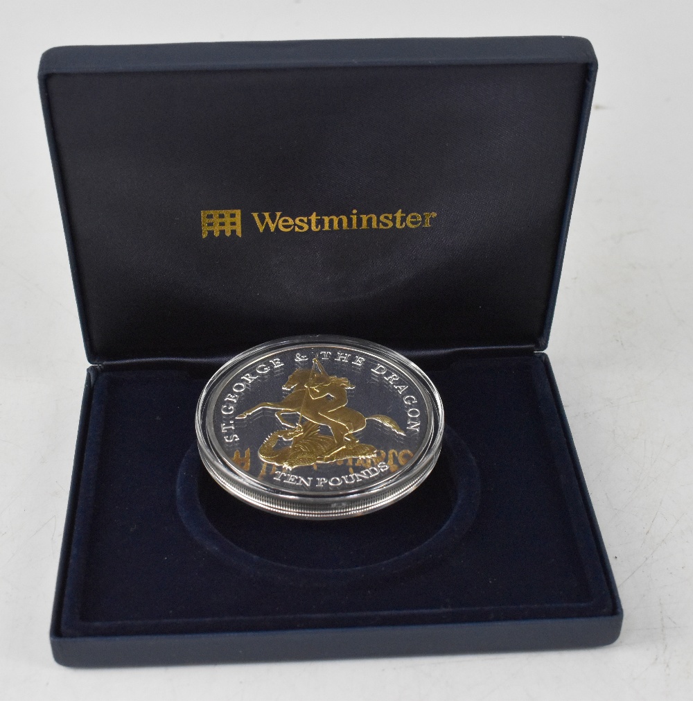 A 2009 'George and Dragon' 5oz, £10 silver coin with gold plated embellishment. - Image 2 of 3