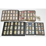 Four albums of cigarette cards, full and part sets including Wills first aid, railway engines,