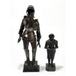 A miniature mock steel suit of armour on wooden stand, height 43.5cm, also a smaller example (2).