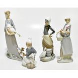 LLADRO; four boxed ceramic figures to include a girl clutching a goose whilst being attacked by a