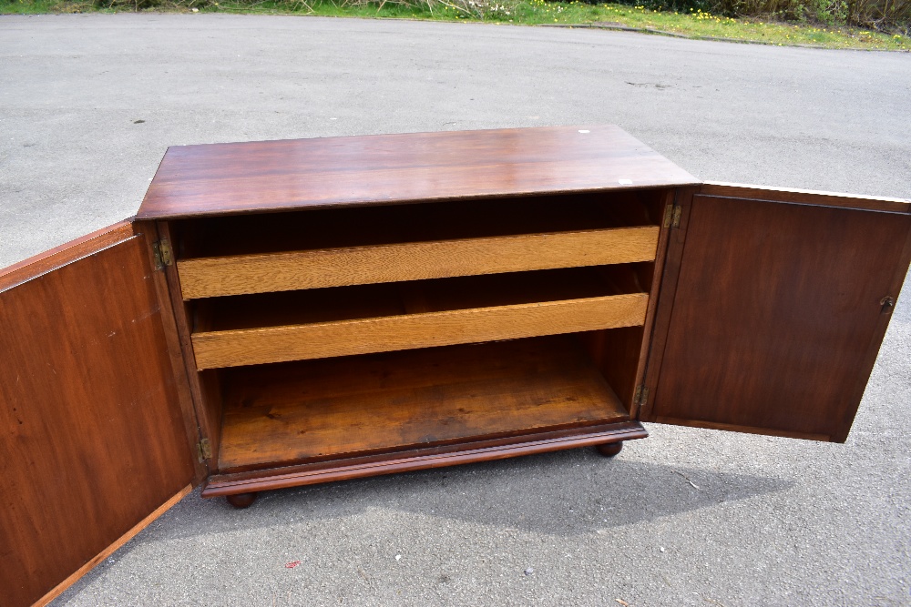 A linen cupboard with pair of panelled doors enclosing two slides, raised on bun feet, height - Image 6 of 6