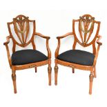 ATTRIBUTED TO HILLE; a pair of c.1900 solid satinwood and parcel gilt elbow chairs with pierced